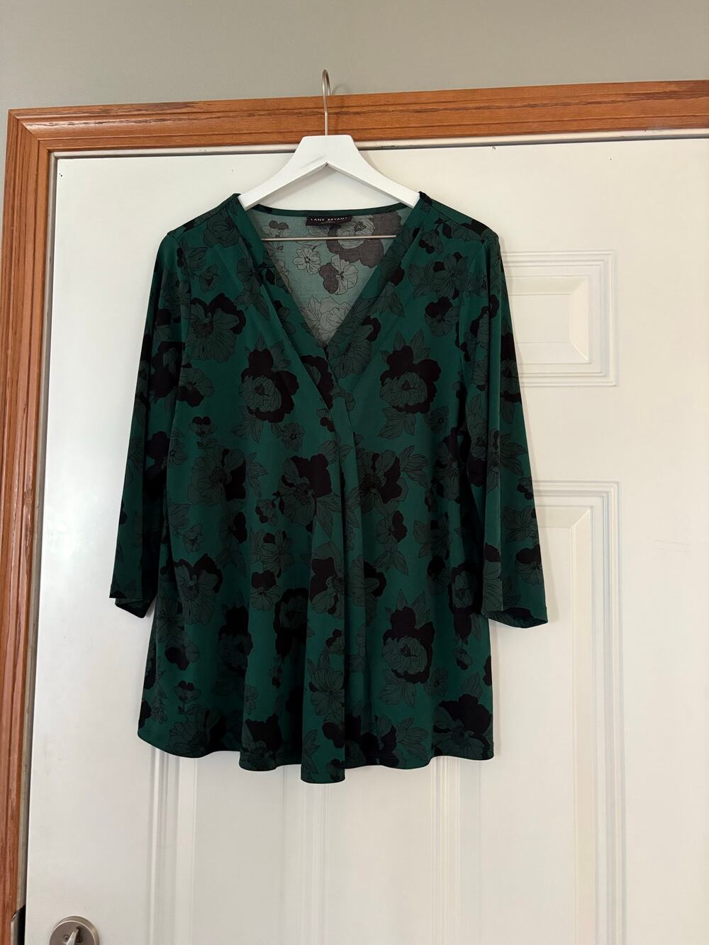 Lane Bryant green floral blouse with a v-neck and 3/4 sleeves Size 14/16